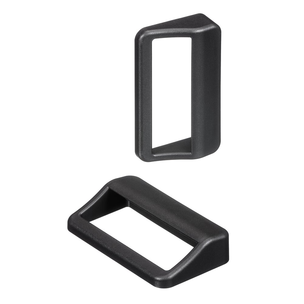 Two black rectangular polyamide carrying handles with fine textured surface, one upright and one lying flat