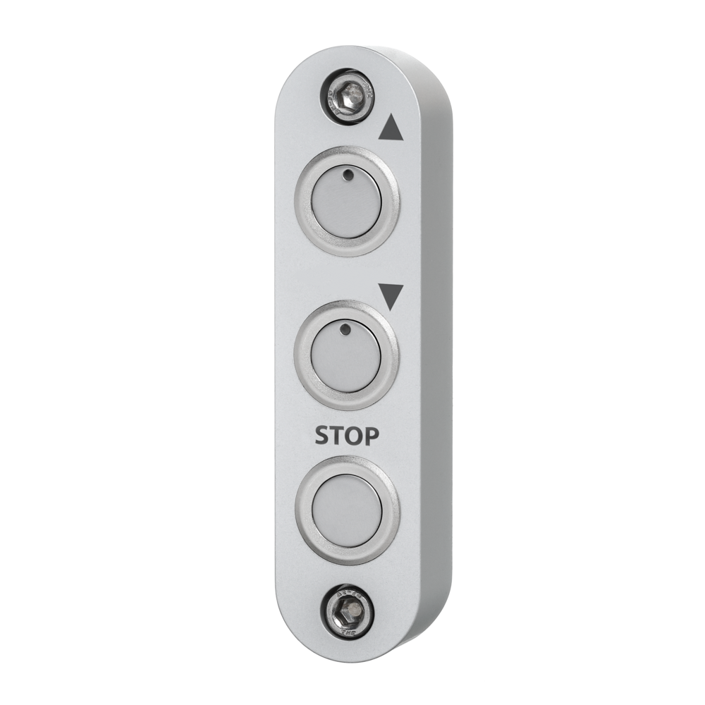 Compact aluminum switch housing TG1 with three push buttons arranged vertically, marked with upward and downward arrows and a stop label.