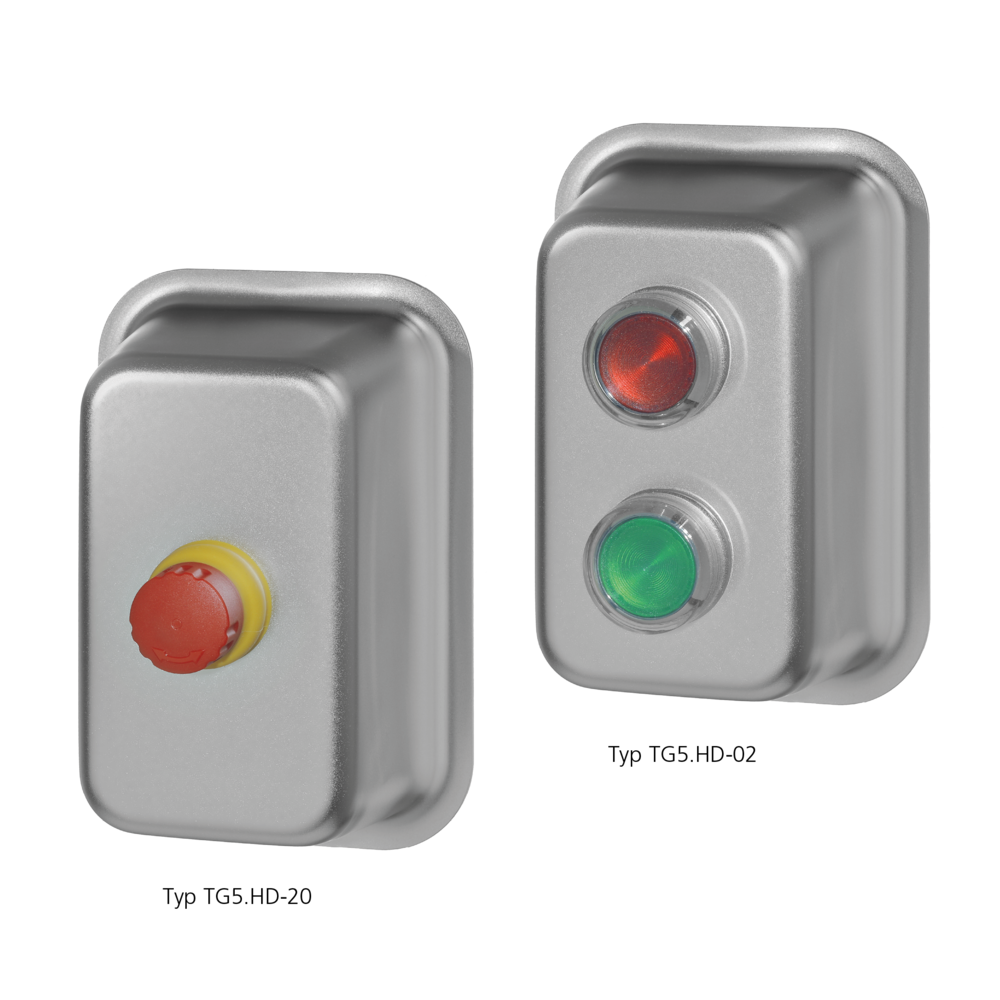 Zwei rechteckige Edelstahlgehäuse: links mit rotem Not-Halt-Schalter, rechts mit rotem und grünem beleuchtetem Drucktaster