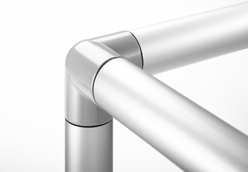 Silver metal tube connector forming a right angle, connecting two horizontal tubes with a vertical tube