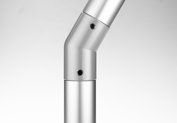 Metallic tube connector joining two cylindrical tubes at a 30°/150° angle with two mounting screws visible