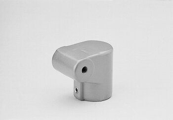 Closed one-layer metal tube connector with a right-angle bend and threaded hole on a white background