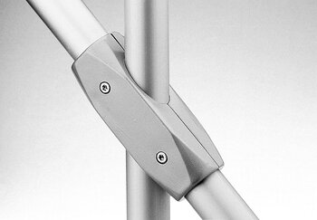 Metallic two-layer tube connector joining three cylindrical tubes at 45 and 135 degrees with screws