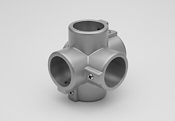 Metallic five-way cross-shaped tube connector with screws, shown on a plain gray background.